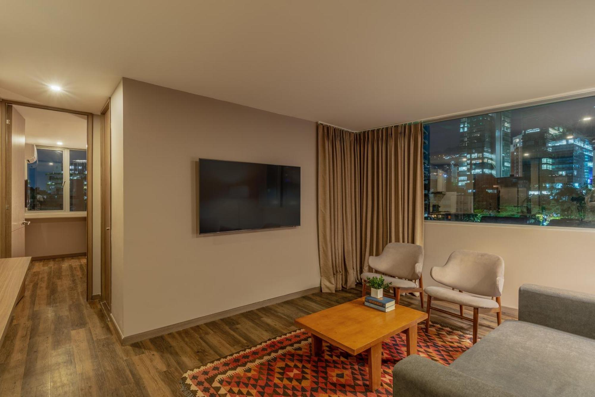 Sites Hotel Medellin Luaran gambar A living room in a modern apartment