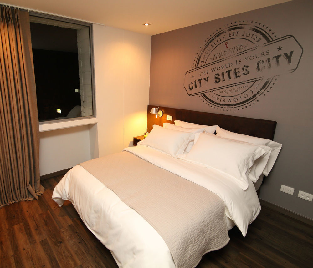Sites Hotel Medellin Luaran gambar A bedroom at the hotel